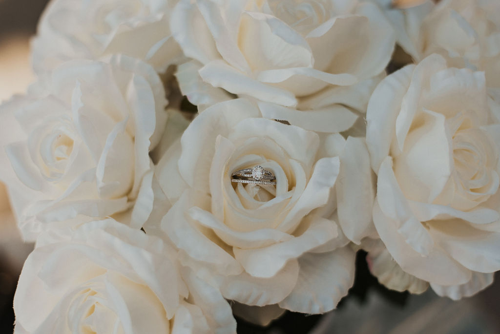 wedding flowers with the wedding rings photo
