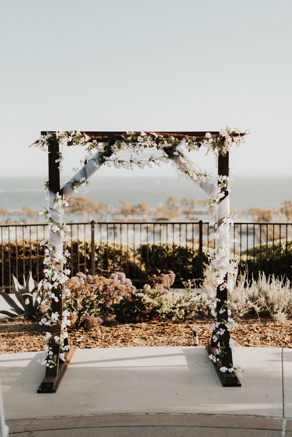 wood wedding arch with flowers