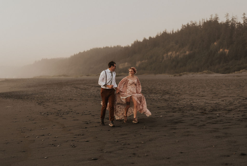 couple running on the beach at their redwoods elopement