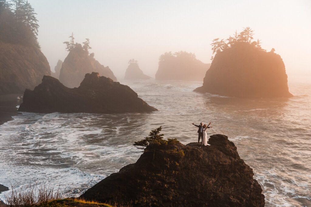 couple standing on ocean cliff