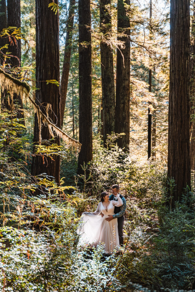 couple dances in a field of huckleberry bushes