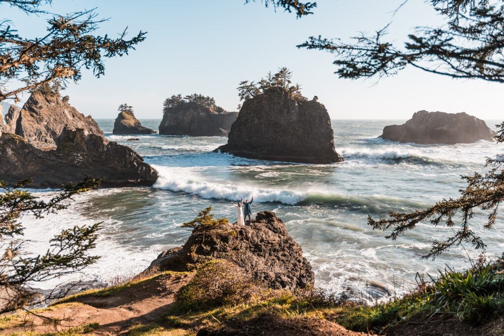 couple standing on the edge of an icean cliff