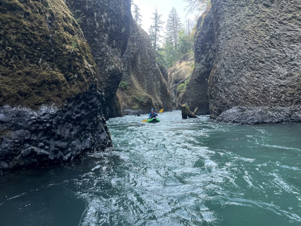 kayaker on the lower white salmon river on a warm day.